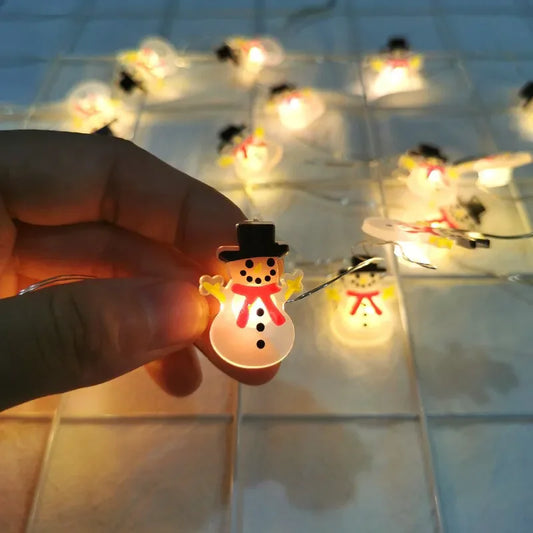 Guirnalda de luces LED de 2 m con 20 LED de Papá Noel y copos de nieve para decoración navideña del hogar. Ideal para adornar el árbol de Navidad o como regalo para niños. Año Nuevo 2025.